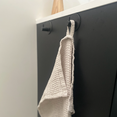 Beige linen tea towel with waffle pattern